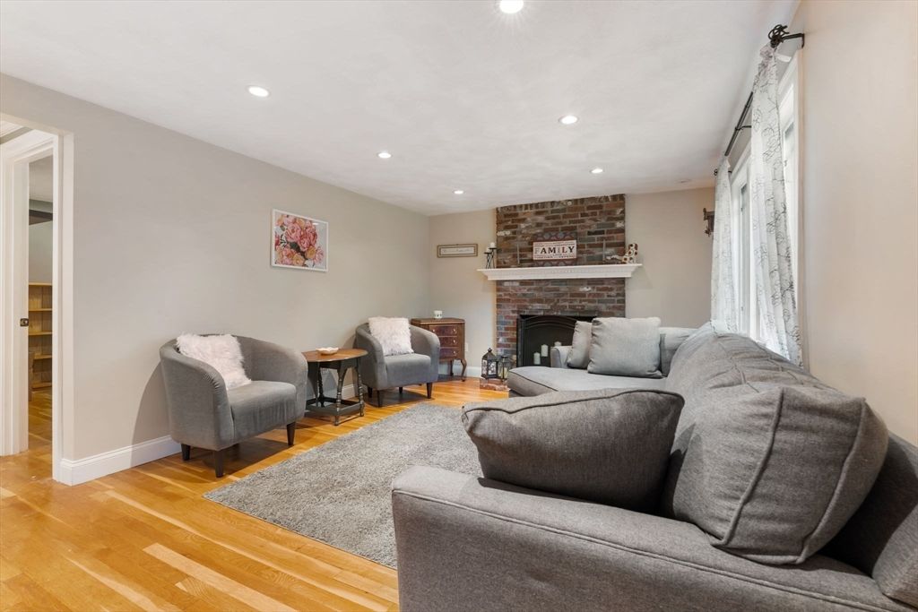 Fireplace, Interior, Living room, Recessed Lighting, Stone Walls, Wood Texture Flooring