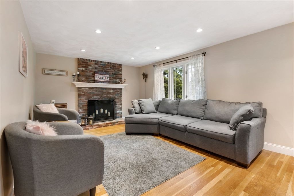 Fireplace, Interior, Living room, Recessed Lighting, Stone Walls, Wood Texture Flooring