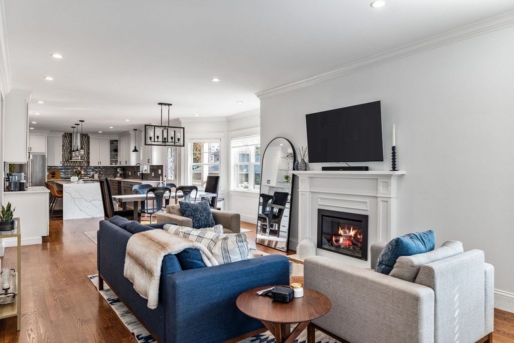 Dining room, Fireplace, Interior, Kitchen, Living room, Pendant Lights, Recessed Lighting, Stainless Steel Appliances, Wood Texture Flooring