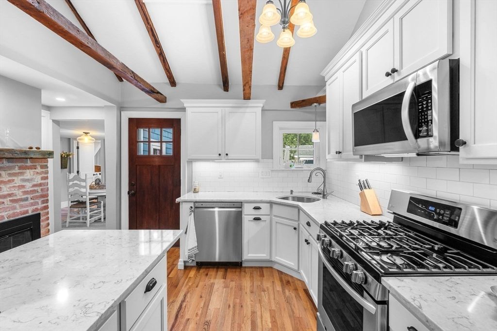 Fireplace, Interior, Kitchen, Recessed Lighting, Stainless Steel Appliances, Wooden Beams, Wood Texture Flooring