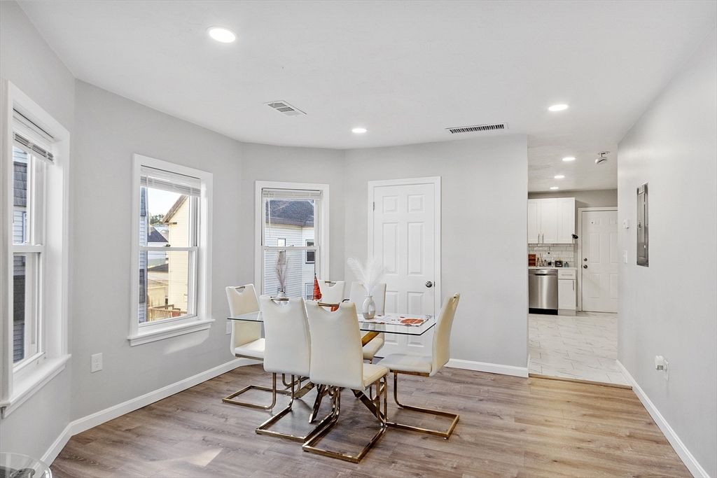 Dining room, Interior, Kitchen, Marble, Recessed Lighting, Stainless Steel Appliances, Wood Texture Flooring