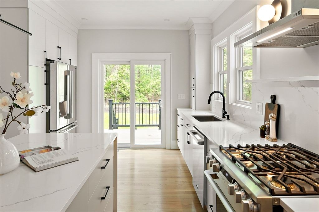 Interior, Kitchen, Marble Walls, Recessed Lighting, Stainless Steel Appliances, Wood Texture Flooring