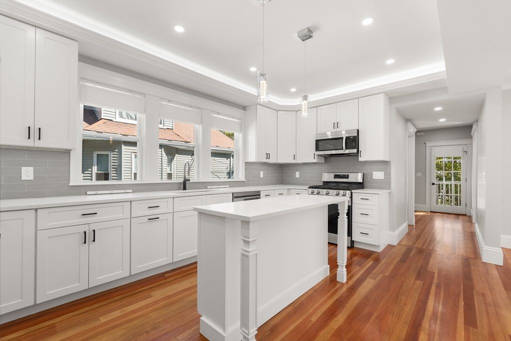 Interior, Kitchen, Pendant Lights, Recessed Lighting, Stainless Steel Appliances, Wood Texture Flooring