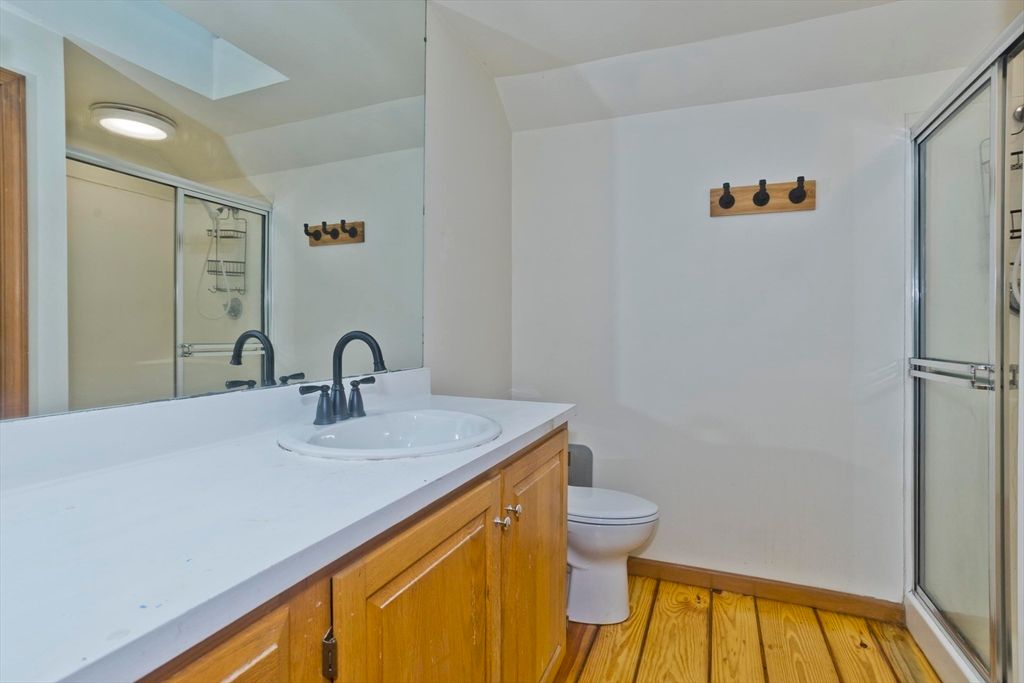 Bathroom, Dual Sink Vanities, Glass Shower, Interior, Wood Texture Flooring