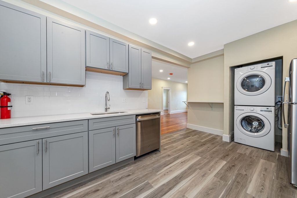 Interior, Kitchen, Recessed Lighting, Washer, Wood Texture Flooring