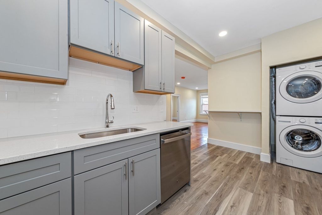 Interior, Kitchen, Recessed Lighting, Washer, Wood Texture Flooring