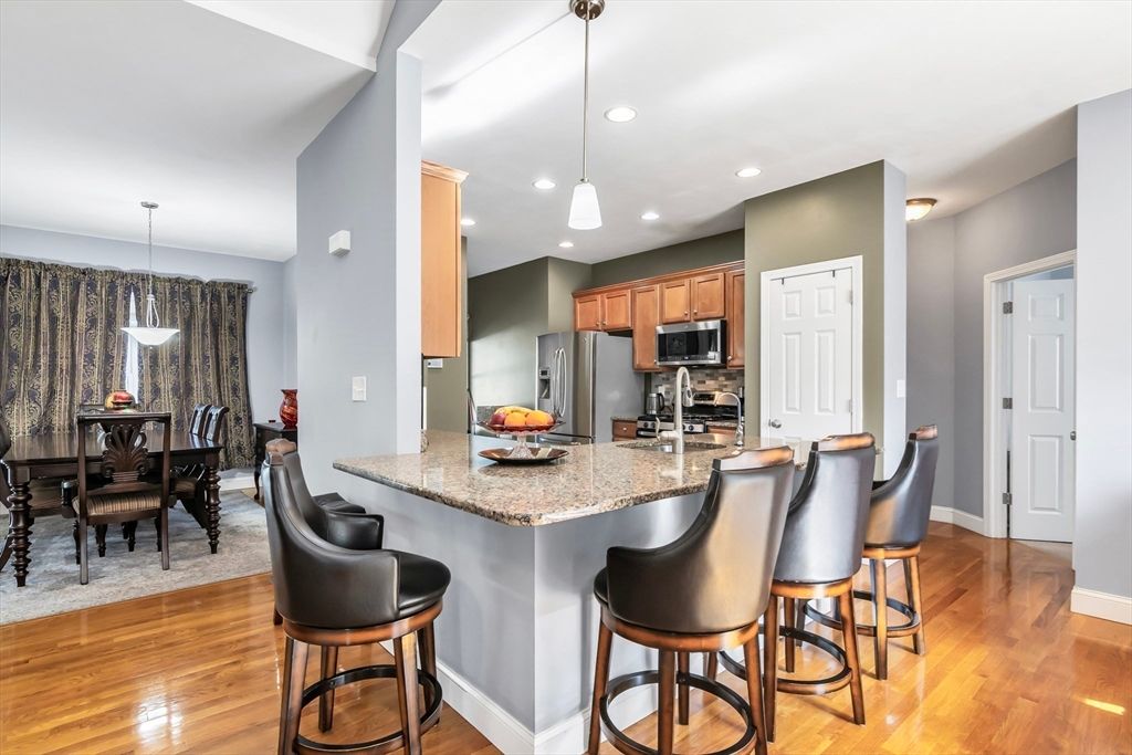 Dining room, Interior, Kitchen, Pendant Lights, Recessed Lighting, Stainless Steel Appliances, Wood Texture Flooring