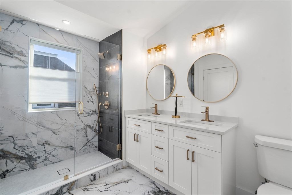 Bathroom, Dual Sink Vanities, Glass Shower, Interior, Marble, Marble Walls, Recessed Lighting