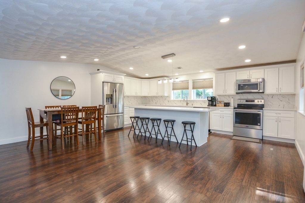 Dining room, Interior, Kitchen, Pendant Lights, Recessed Lighting, Stainless Steel Appliances, Wood Texture Flooring