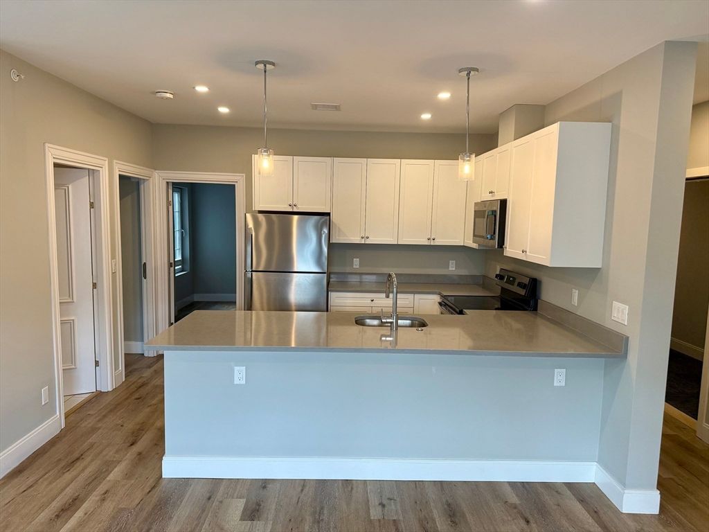 Interior, Kitchen, Pendant Lights, Recessed Lighting, Stainless Steel Appliances, Wood Texture Flooring