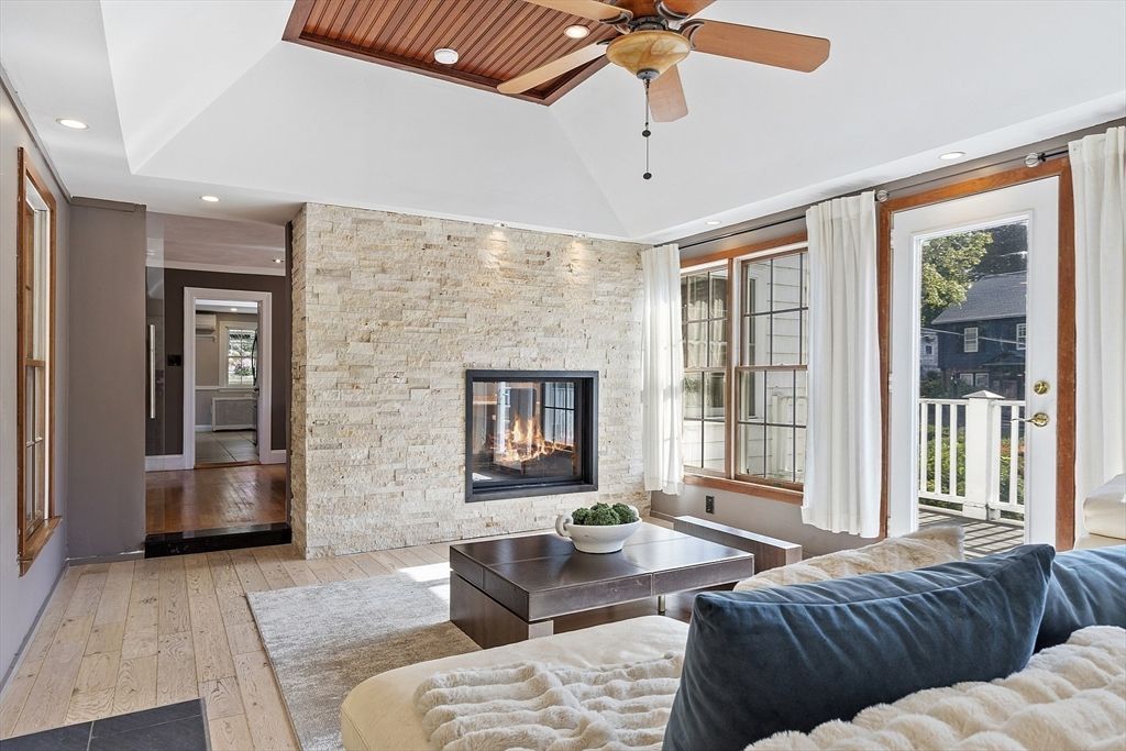 Fireplace, Interior, Living room, Recessed Lighting, Stone Walls, Wood Texture Flooring