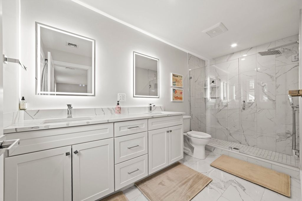 Bathroom, Dual Sink Vanities, Glass Shower, Interior, Marble, Marble Walls, Recessed Lighting