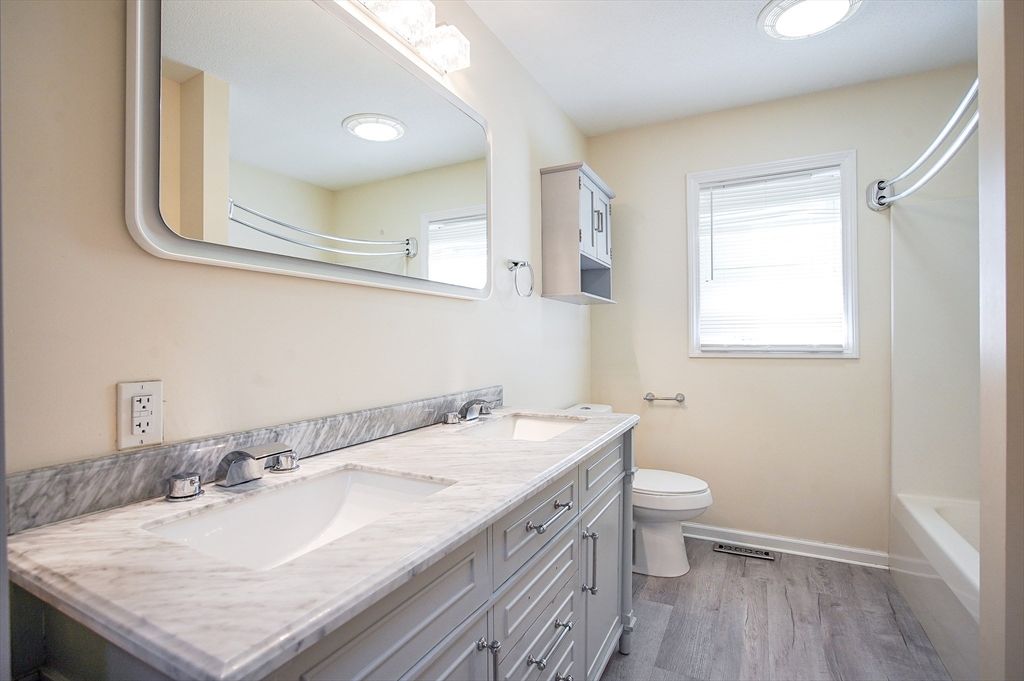 Bathroom, Dual Sink Vanities, Interior, Recessed Lighting, Wood Texture Flooring