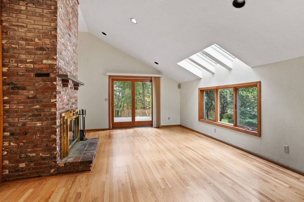 Empty room, Fireplace, Interior, Recessed Lighting, Stone Walls, Wood Texture Flooring