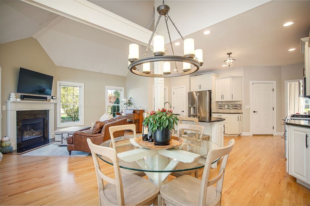 Chandelier, Dining room, Fireplace, Interior, Kitchen, Living room, Pendant Lights, Recessed Lighting, Stainless Steel Appliances, Wood Texture Flooring