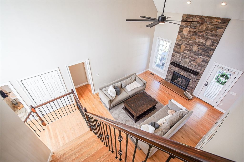 Fireplace, Interior, Living room, Recessed Lighting, Stone Walls, Wood Texture Flooring