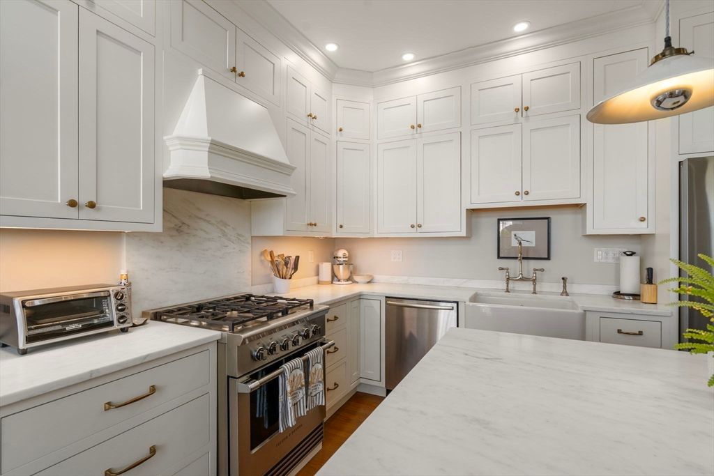 Interior, Kitchen, Marble Walls, Recessed Lighting, Stainless Steel Appliances, Wood Texture Flooring