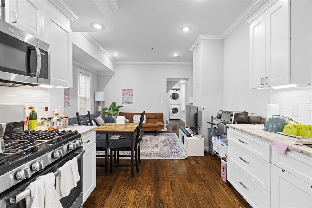 Dining room, Interior, Kitchen, Living room, Recessed Lighting, Stainless Steel Appliances, Washer, Wood Texture Flooring