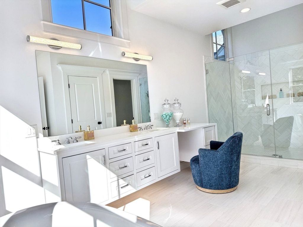 Bathroom, Dual Sink Vanities, Glass Shower, Interior, Marble Walls, Recessed Lighting, Wood Texture Flooring