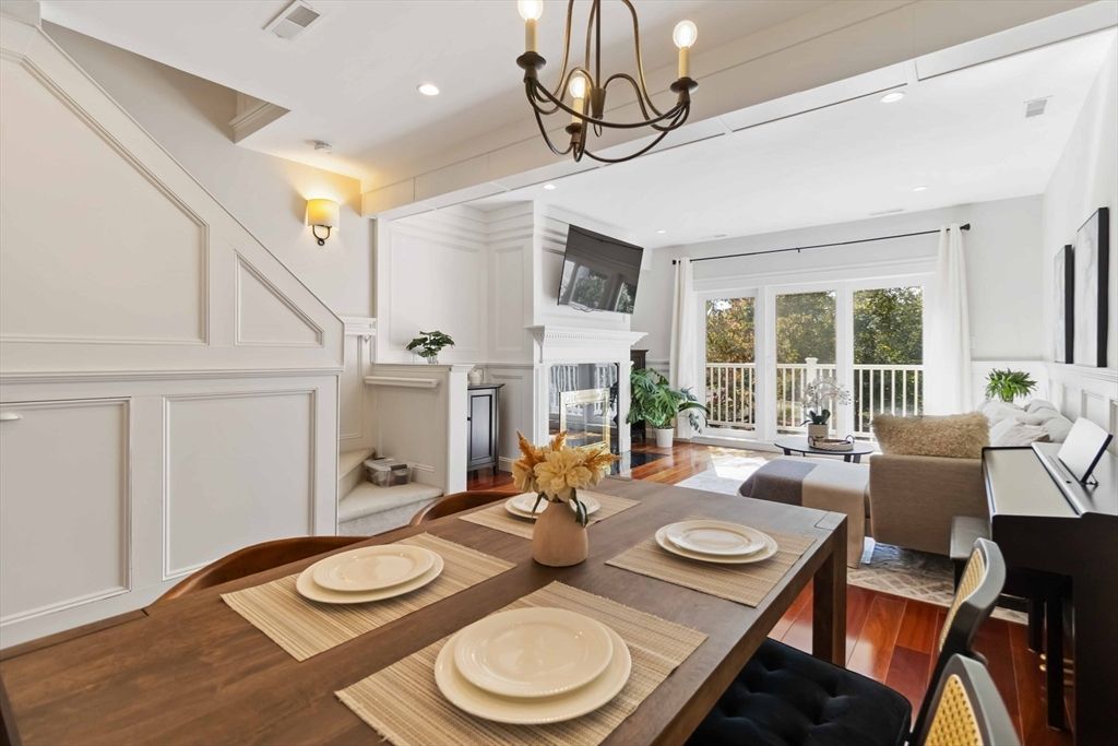 Chandelier, Dining room, Fireplace, Interior, Living room, Piano, Recessed Lighting, Wood Texture Flooring