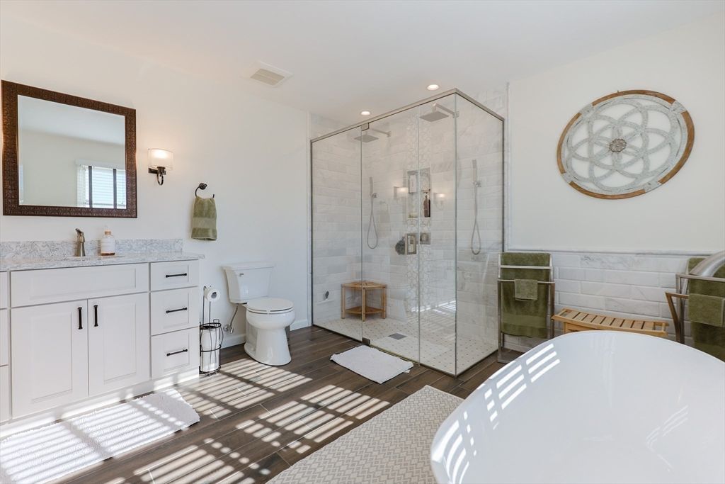 Bathroom, Free Standing Baths, Glass Shower, Interior, Recessed Lighting, Wood Texture Flooring