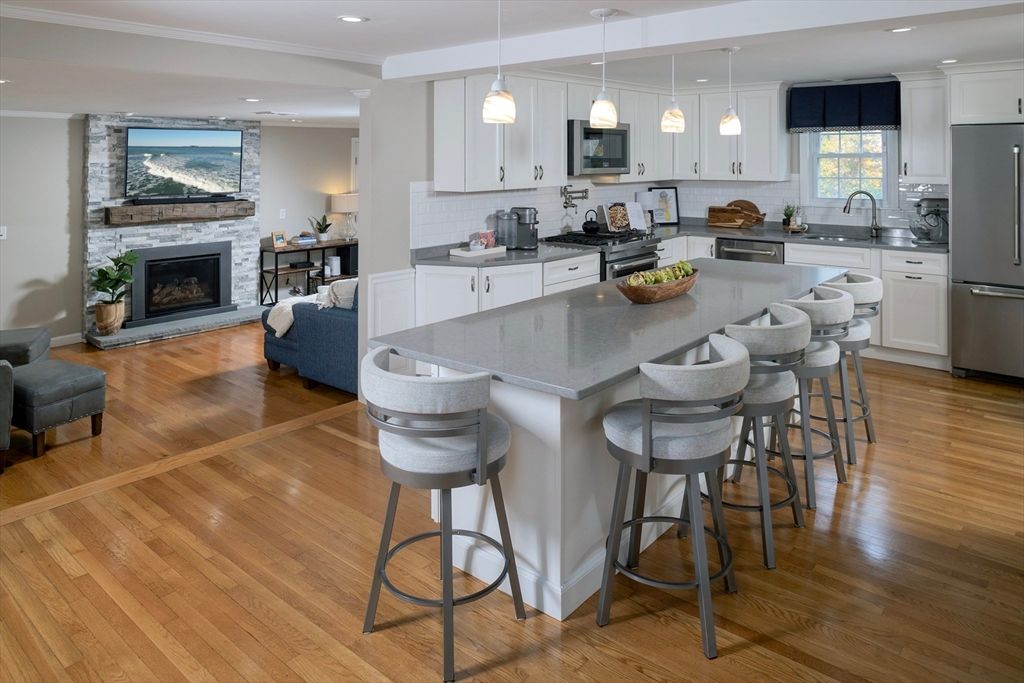 Fireplace, Interior, Kitchen, Living room, Pendant Lights, Recessed Lighting, Stainless Steel Appliances, Wood Texture Flooring