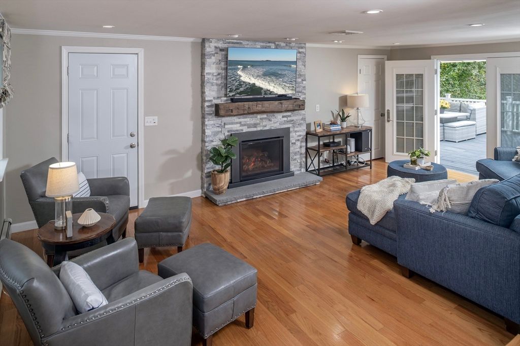 Fireplace, Interior, Living room, Recessed Lighting, Stone Walls, Wood Texture Flooring