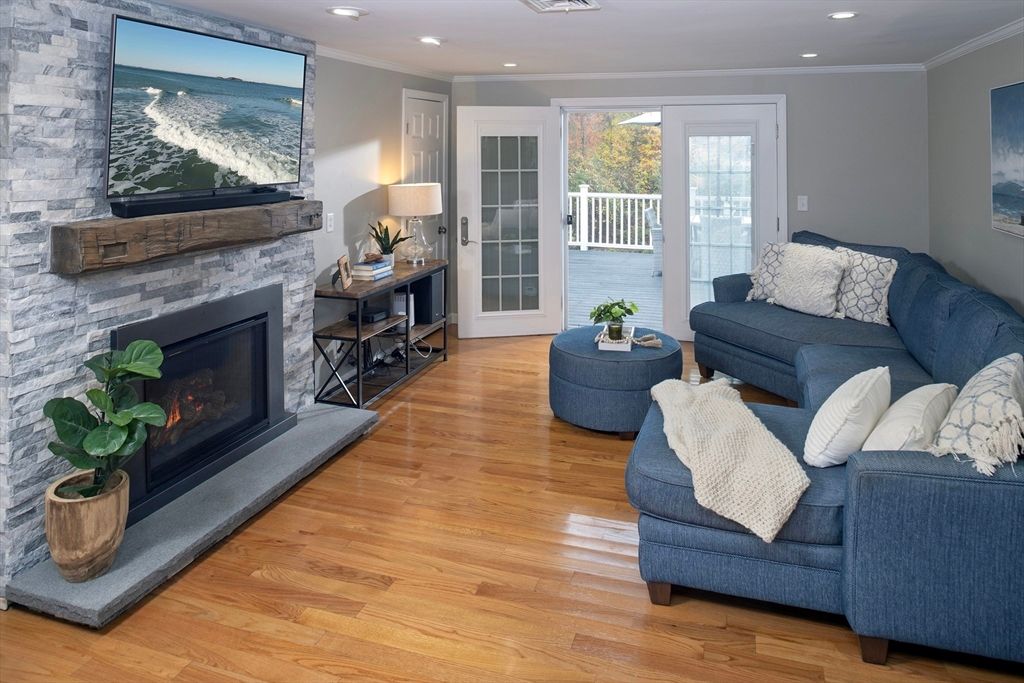 Fireplace, Interior, Living room, Recessed Lighting, Stone Walls, Wood Texture Flooring