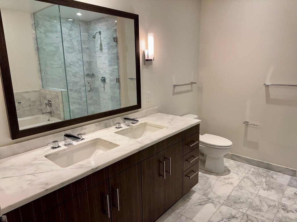 Bathroom, Dual Sink Vanities, Glass Shower, Interior, Marble, Marble Walls, Recessed Lighting