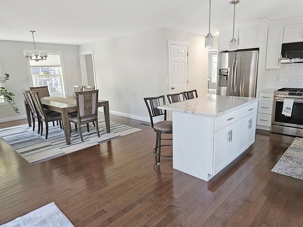 Chandelier, Dining room, Interior, Kitchen, Pendant Lights, Stainless Steel Appliances, Wood Texture Flooring
