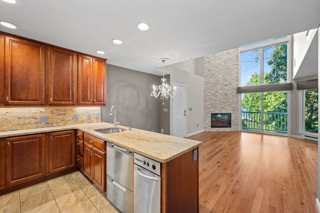 Chandelier, Fireplace, Interior, Kitchen, Recessed Lighting, Stone Walls, Wood Texture Flooring