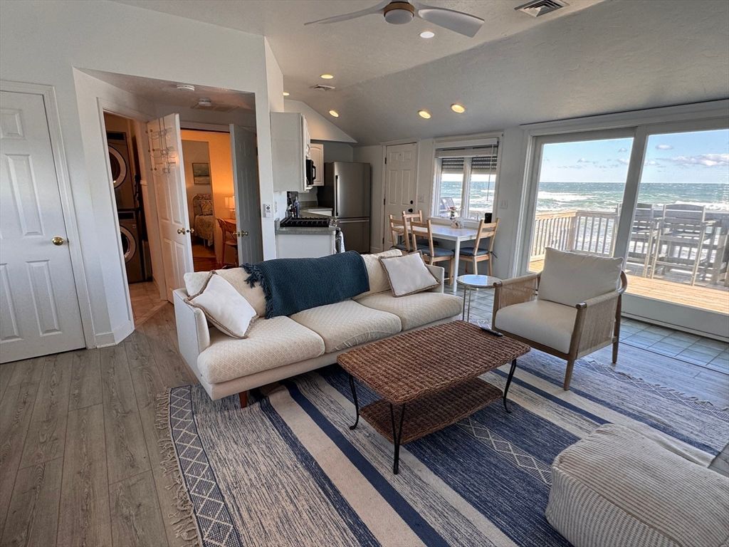 Dining room, Interior, Kitchen, Living room, Recessed Lighting, Stainless Steel Appliances, Water, Wood Texture Flooring
