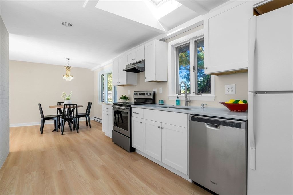 Dining room, Interior, Kitchen, Pendant Lights, Recessed Lighting, Stainless Steel Appliances, Wood Texture Flooring