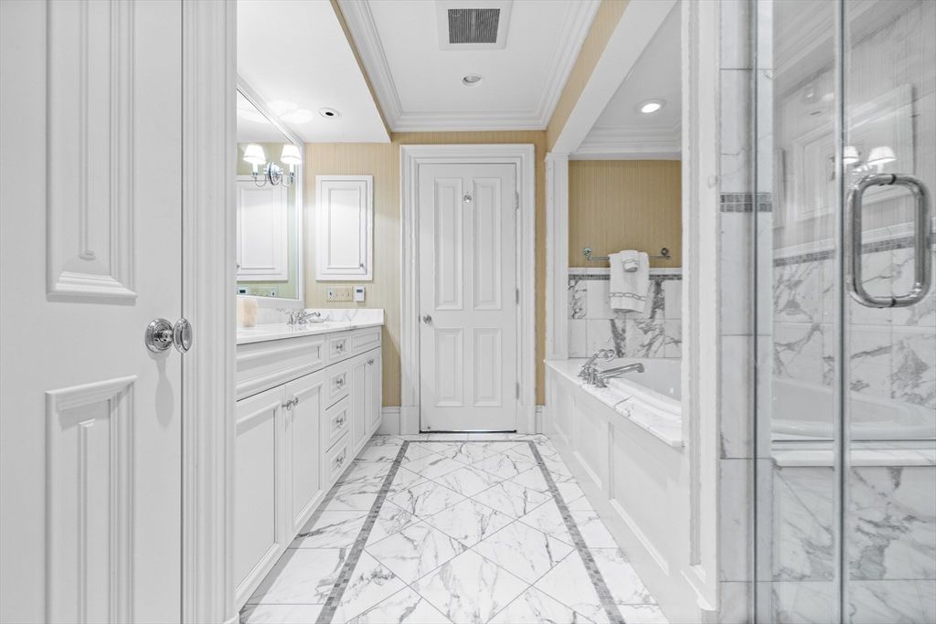 Bathroom, Dual Sink Vanities, Glass Shower, Interior, Marble, Marble Walls, Recessed Lighting