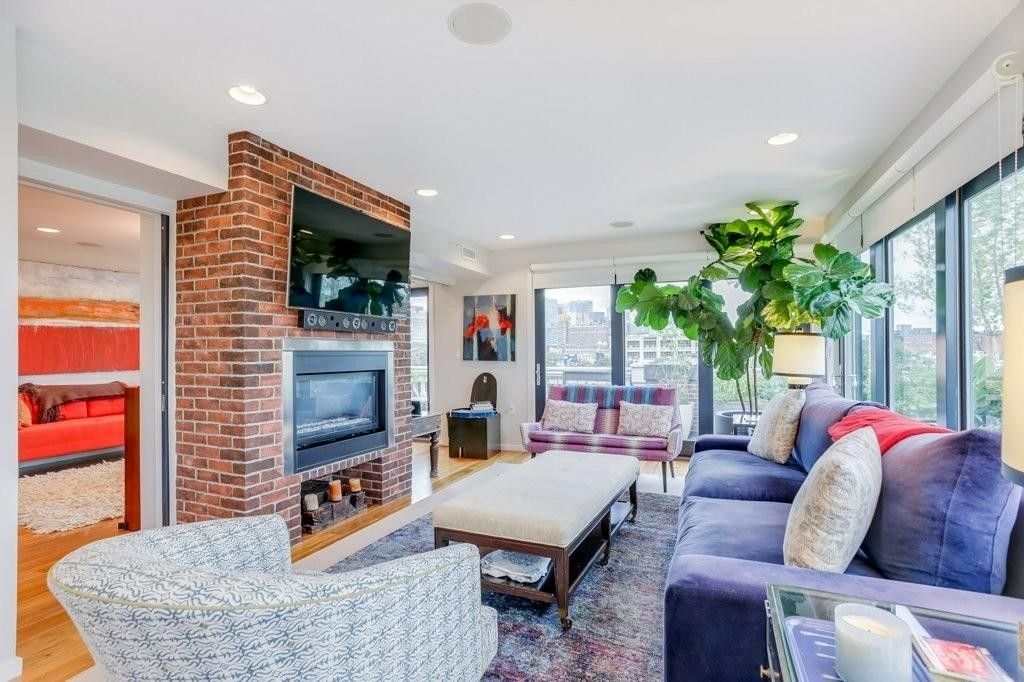 Fireplace, Interior, Living room, Recessed Lighting, Stone Walls, Wood Texture Flooring