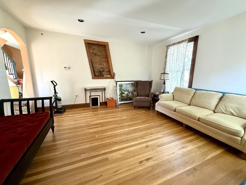 Fireplace, Fitness Equipment, Interior, Living room, Recessed Lighting, Wood Texture Flooring