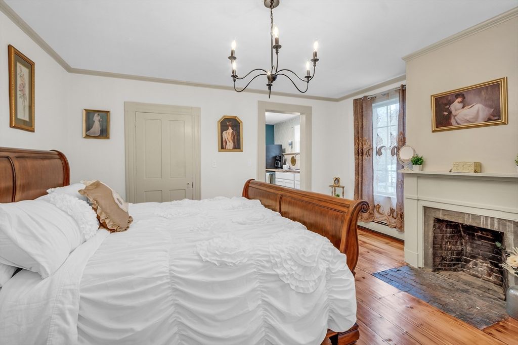 Bedroom, Chandelier, Fireplace, Interior, Wood Texture Flooring