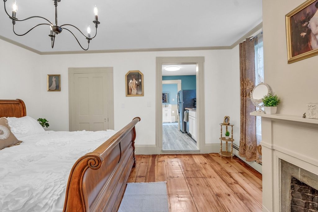 Bedroom, Chandelier, Fireplace, Interior, Wood Texture Flooring