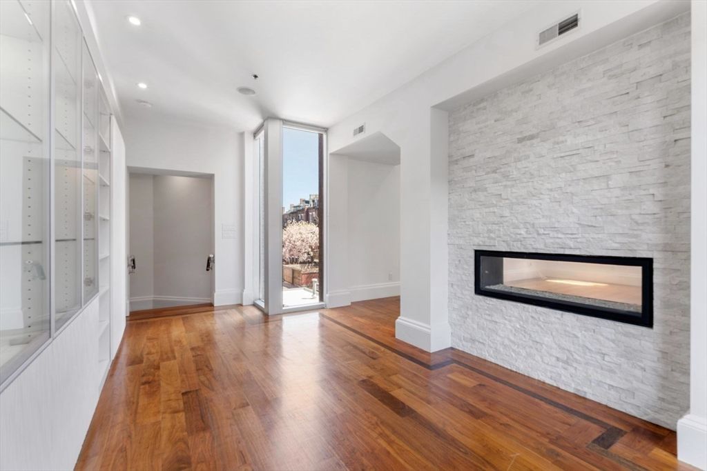 Empty room, Fireplace, Interior, Recessed Lighting, Stone Walls, Wood Texture Flooring