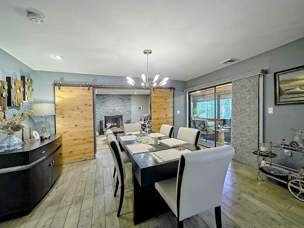 Dining room, Fireplace, Interior, Pendant Lights, Recessed Lighting, Stone Walls, Wood Texture Flooring, Wooden Walls