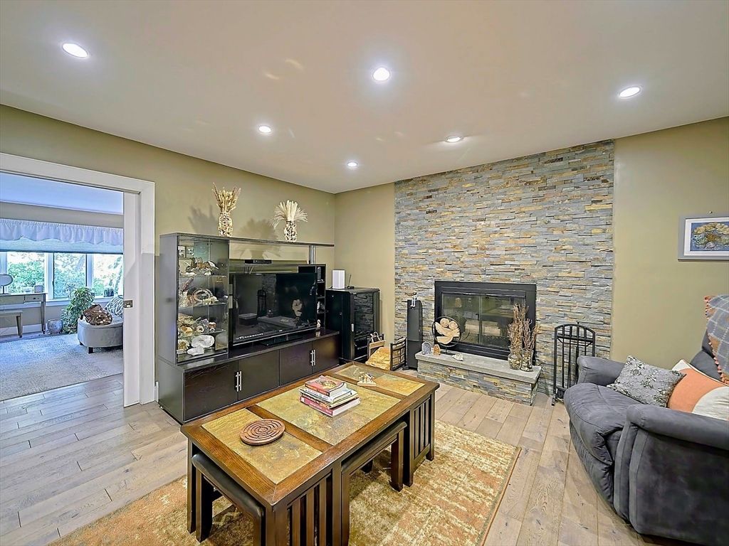 Fireplace, Interior, Living room, Recessed Lighting, Stone Walls, Wood Texture Flooring
