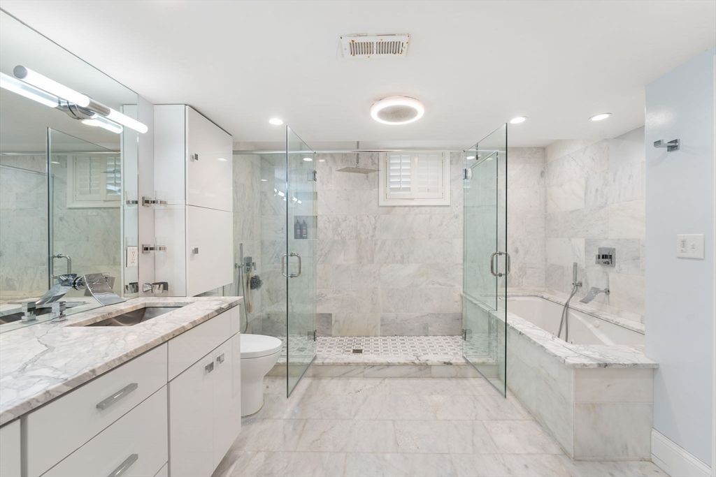 Bathroom, Dual Sink Vanities, Glass Shower, Interior, Marble, Marble Walls, Recessed Lighting