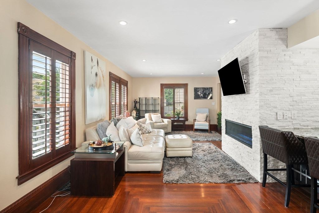 Fireplace, Interior, Living room, Recessed Lighting, Stone Walls, Wood Texture Flooring