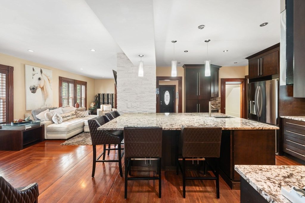 Interior, Kitchen, Living room, Pendant Lights, Recessed Lighting, Stainless Steel Appliances, Stone Walls, Wood Texture Flooring