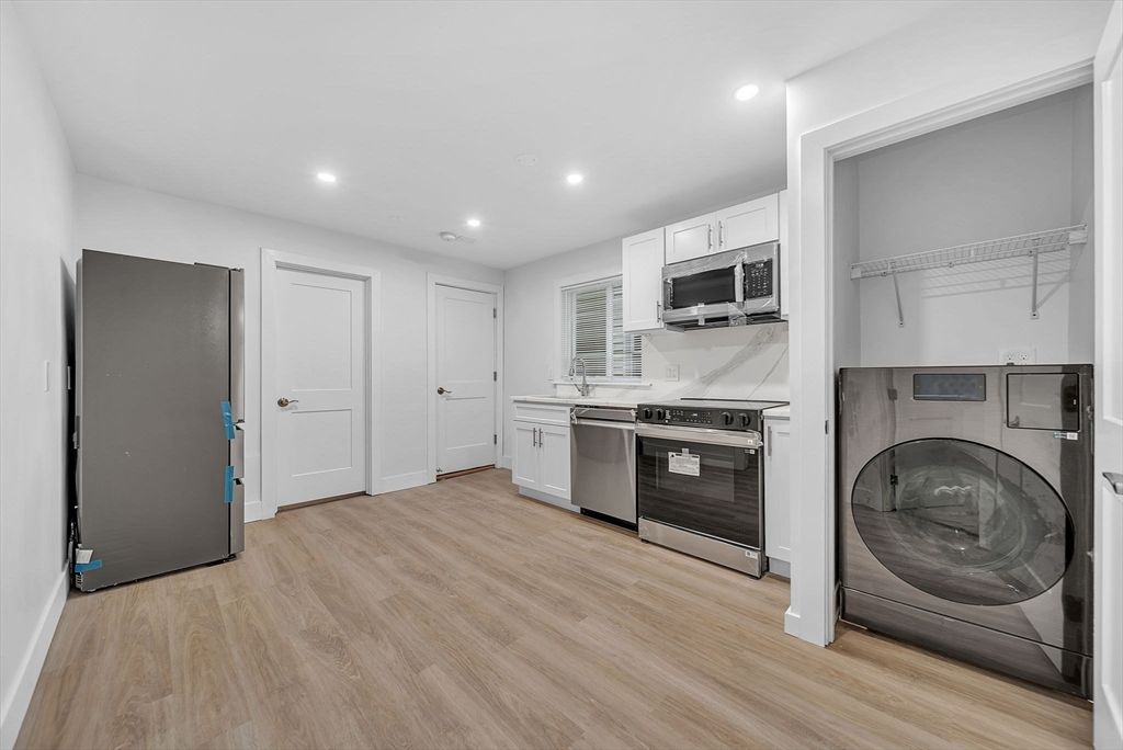 Interior, Kitchen, Recessed Lighting, Stainless Steel Appliances, Washer, Wood Texture Flooring