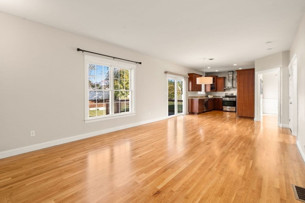 Empty room, Interior, Kitchen, Pendant Lights, Recessed Lighting, Stainless Steel Appliances, Wood Texture Flooring
