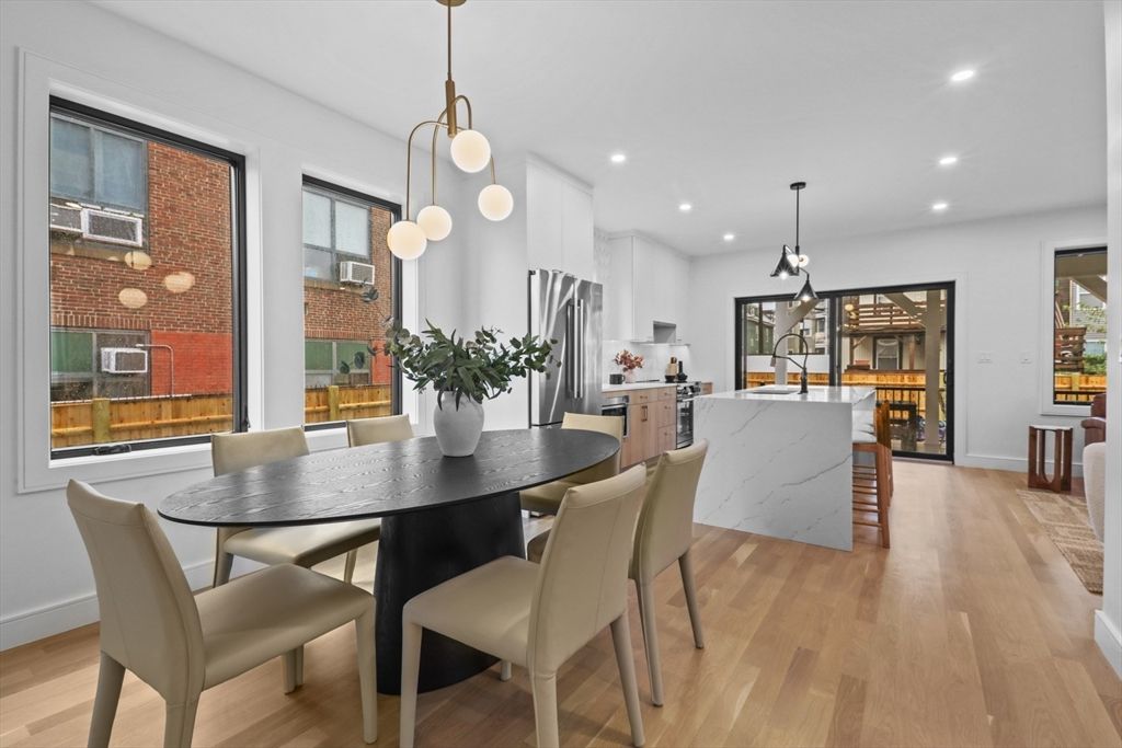 Dining room, Interior, Kitchen, Pendant Lights, Recessed Lighting, Stainless Steel Appliances, Wood Texture Flooring