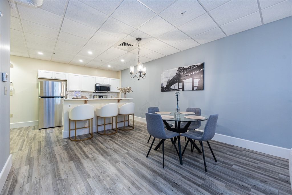 Chandelier, Dining room, Interior, Kitchen, Pendant Lights, Recessed Lighting, Stainless Steel Appliances, Wood Texture Flooring