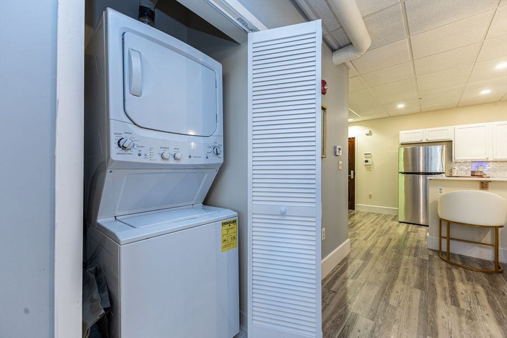 Interior, Kitchen, Recessed Lighting, Utility Closets, Washer, Wood Texture Flooring