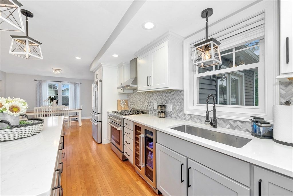 Dining room, Interior, Kitchen, Pendant Lights, Recessed Lighting, Stainless Steel Appliances, Wood Texture Flooring